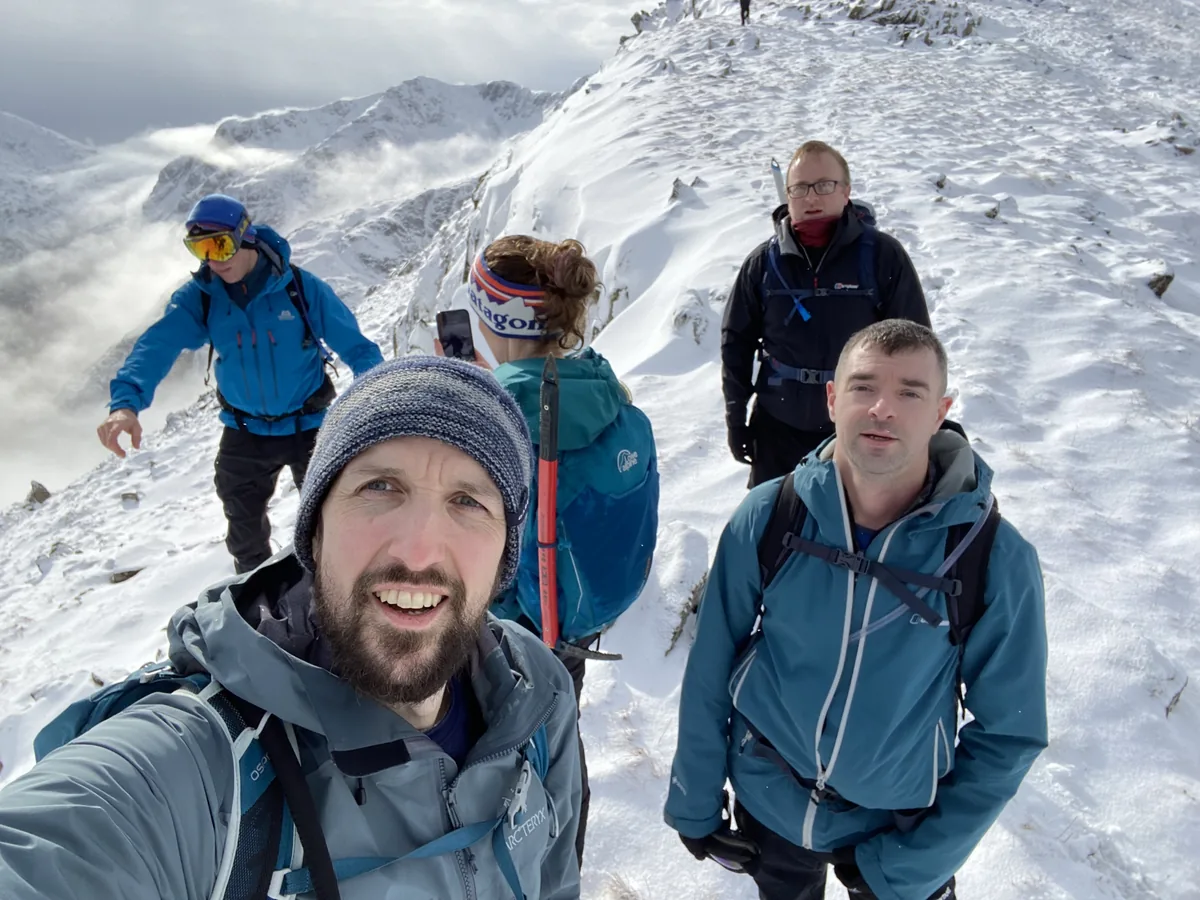Happy group on snowy ridge